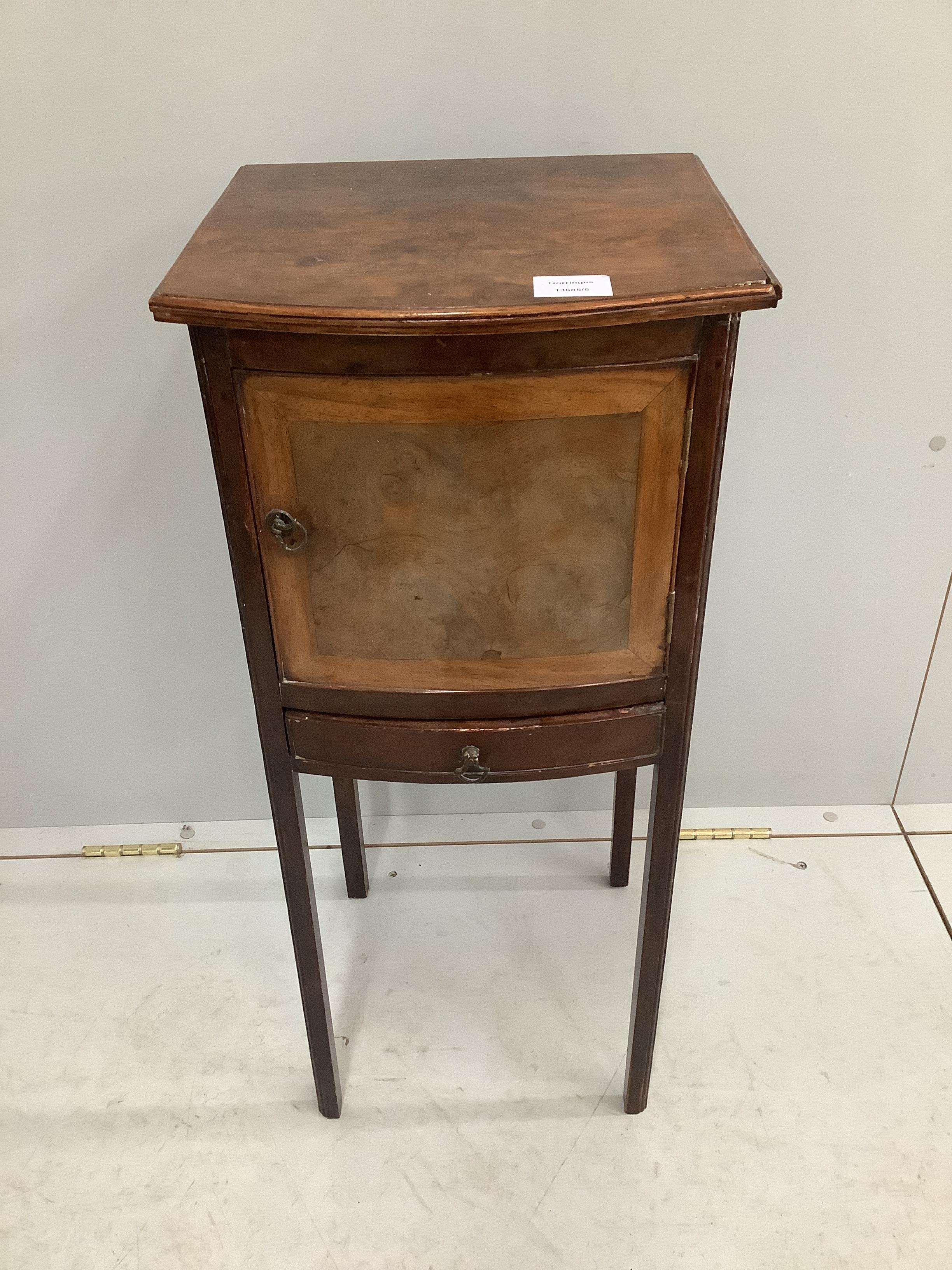 A George III style walnut bowfront bedside cabinet, width 32cm, depth 30cm, height 74cm